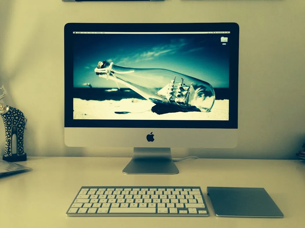 The iMac on my desk, with its keyboard and trackpad